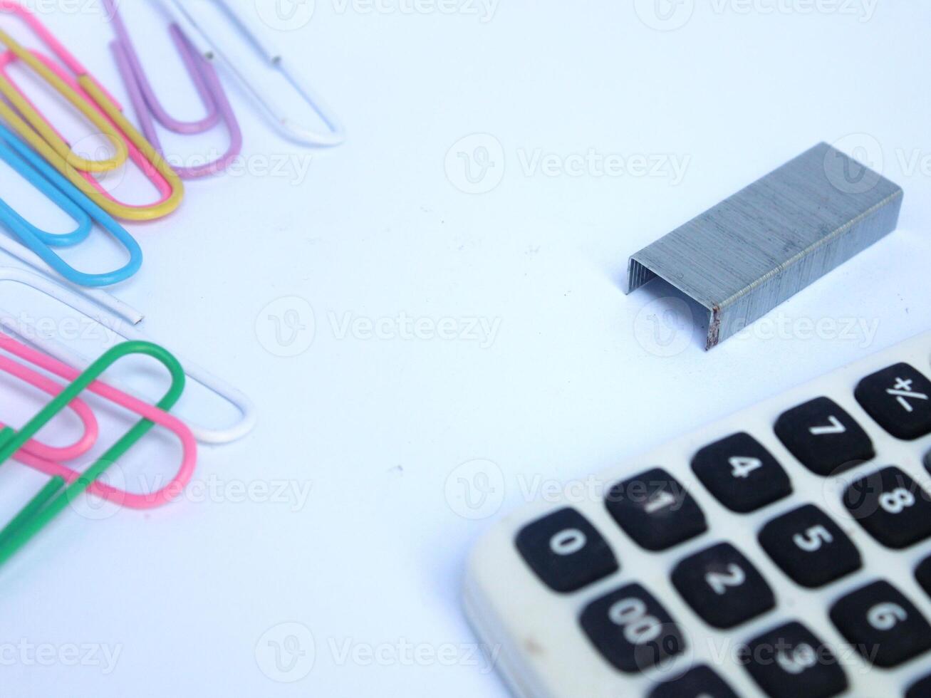 design of work or office equipment tools in the form of paper clips, calculators, and staples photo