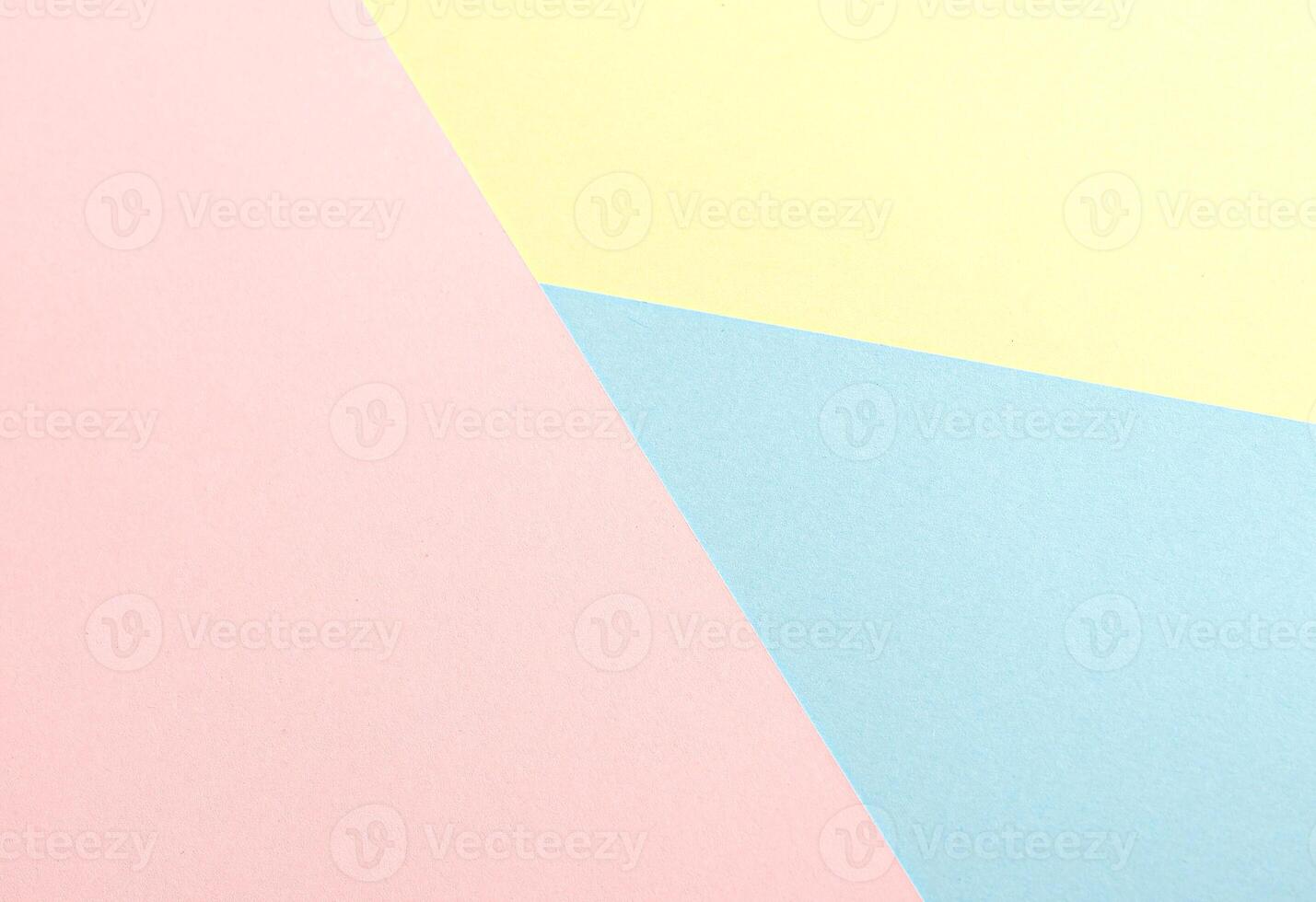 Pastel abstract geometric paper background featuring pink, yellow, and blue in a modern minimalist photo