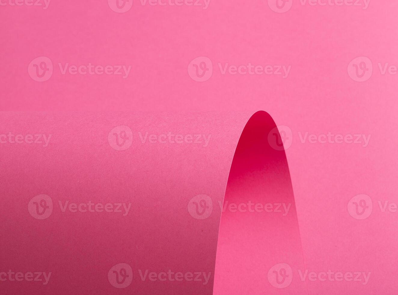 Pink paper background with a smooth matte finish and soft pastel tones. Vibrant magenta, mauve, and photo