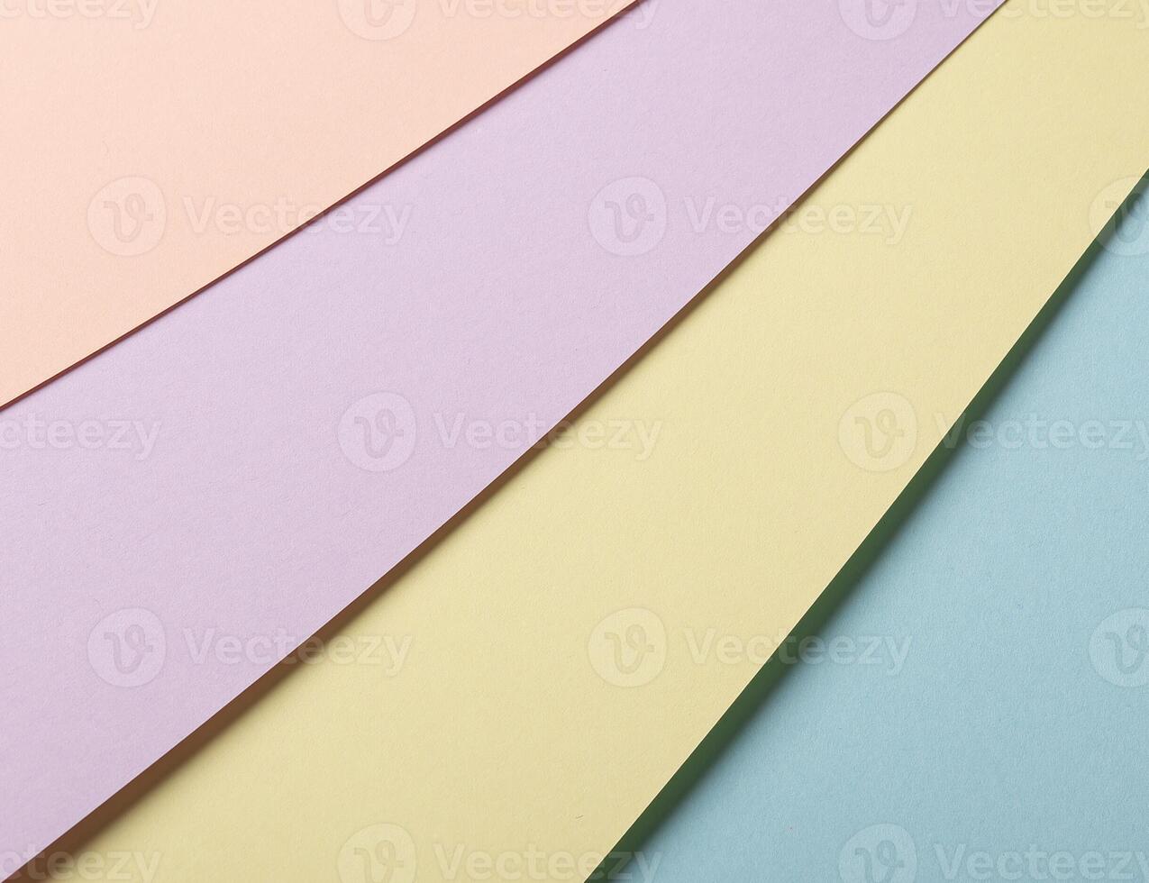 Pastel abstract geometric striped paper background featuring a multicolored composition in peach, photo
