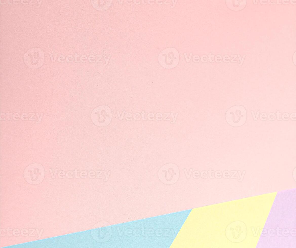 A pastel abstract background with a geometric arrangement of multicolored paper in soft tones, photo