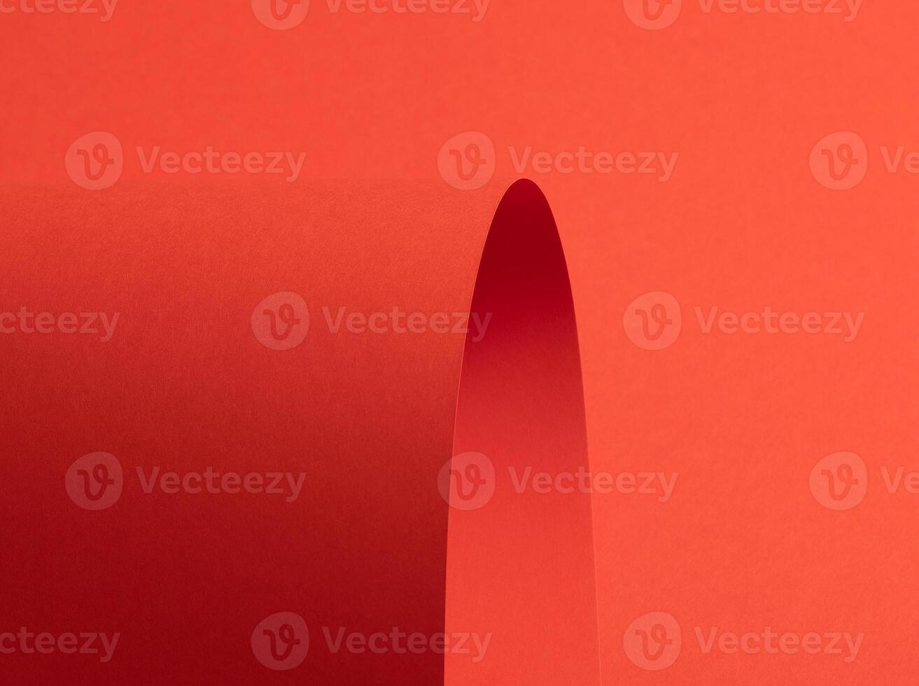 Fiesta red and orange paper background with a matte finish and smooth, curved folds forming elegant photo