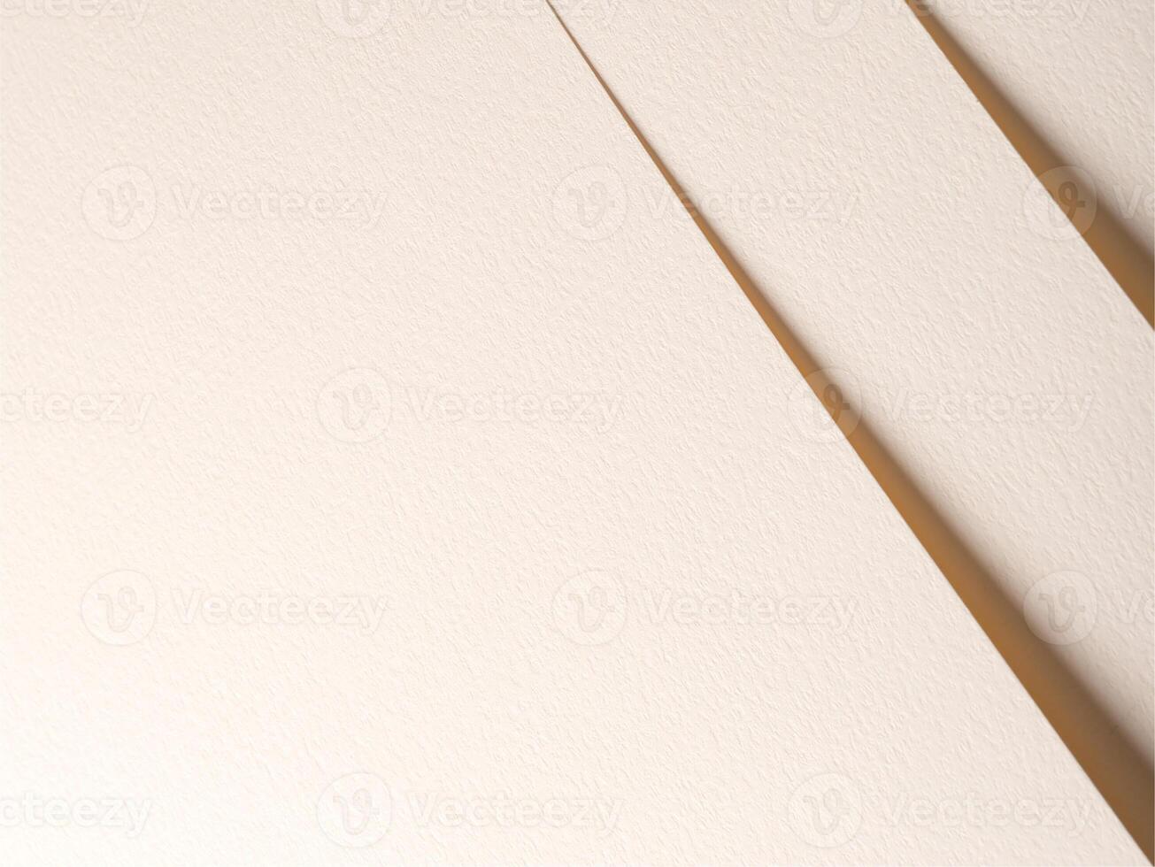 A textured beige paper background featuring overlapping edges and soft shadows, creating depth and photo