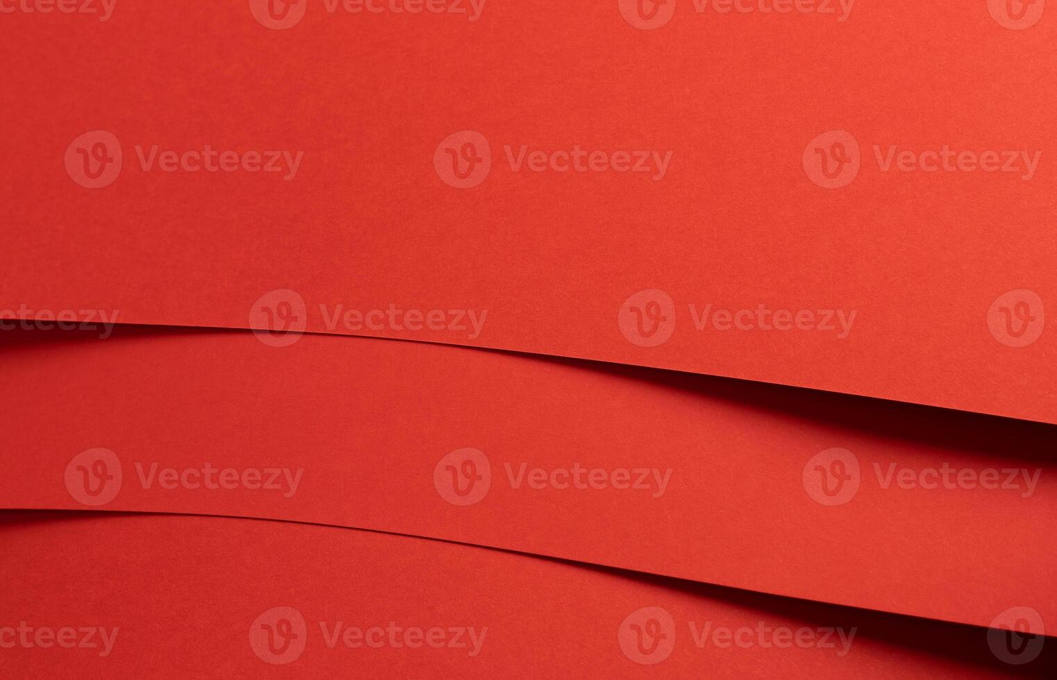 Fiesta red and orange paper background with curved, smooth layers and a matte finish. Rich, photo