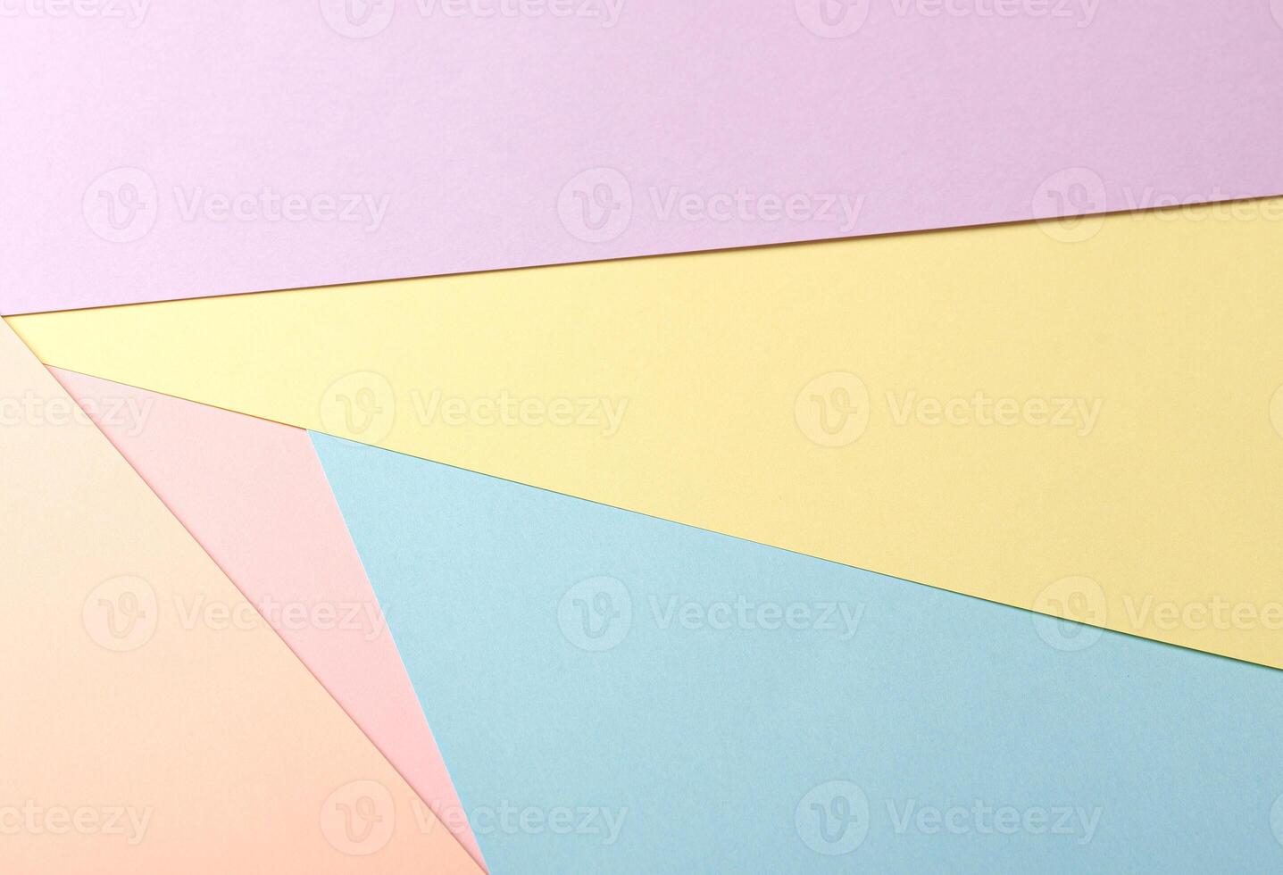 Pastel abstract geometric paper background with lavender, yellow, blue, peach, and pink tones photo