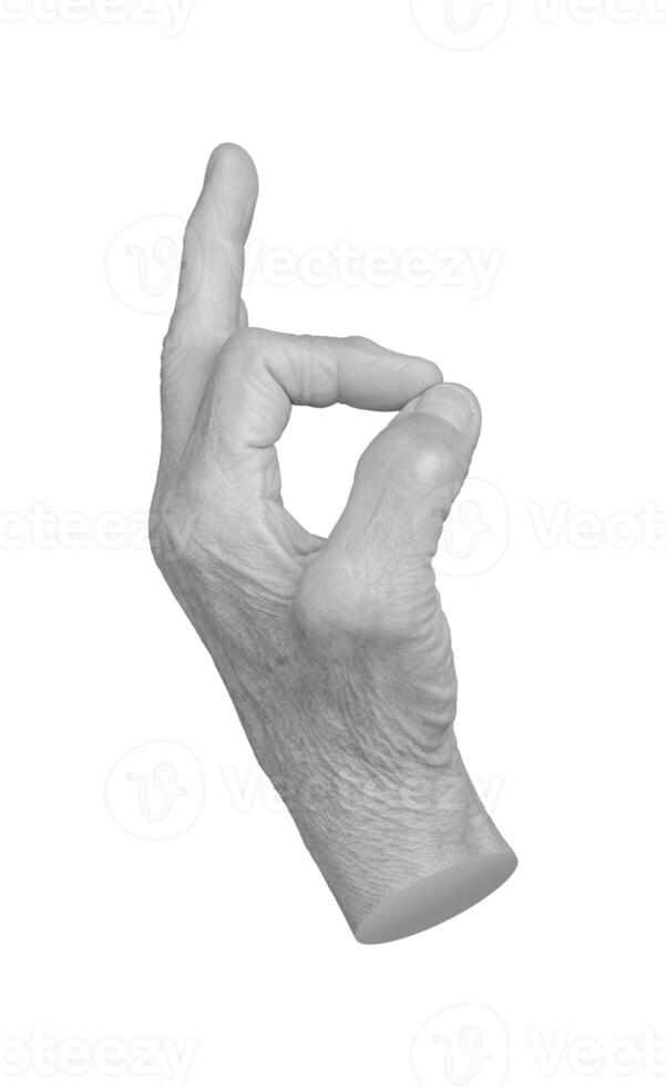 Elderly female hand with wrinkled skin showing an OK gesture, symbolizing approval, success, and photo