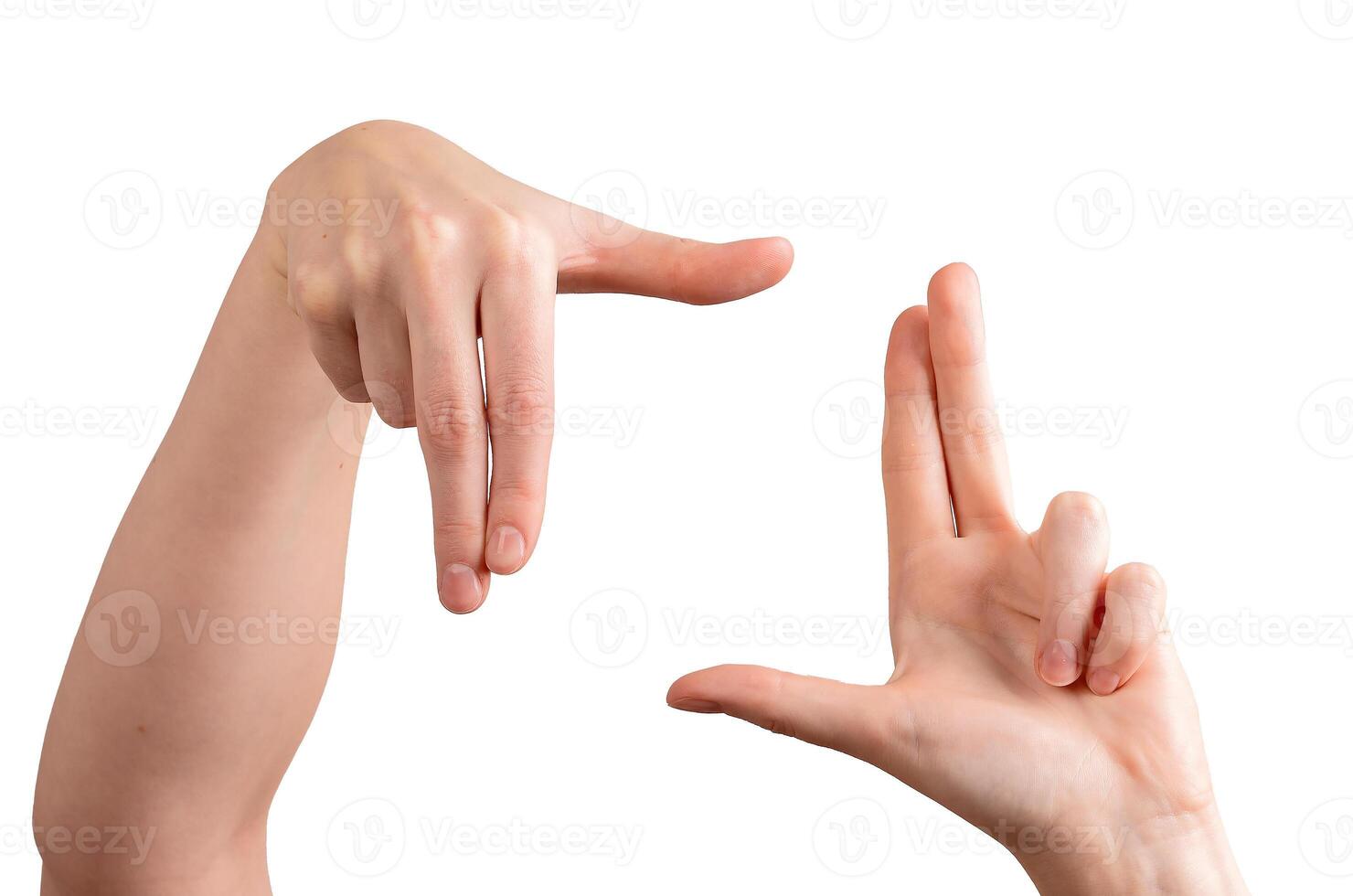 Female hands forming a framing gesture, fingers and thumbs creating a perspective for composition, photo