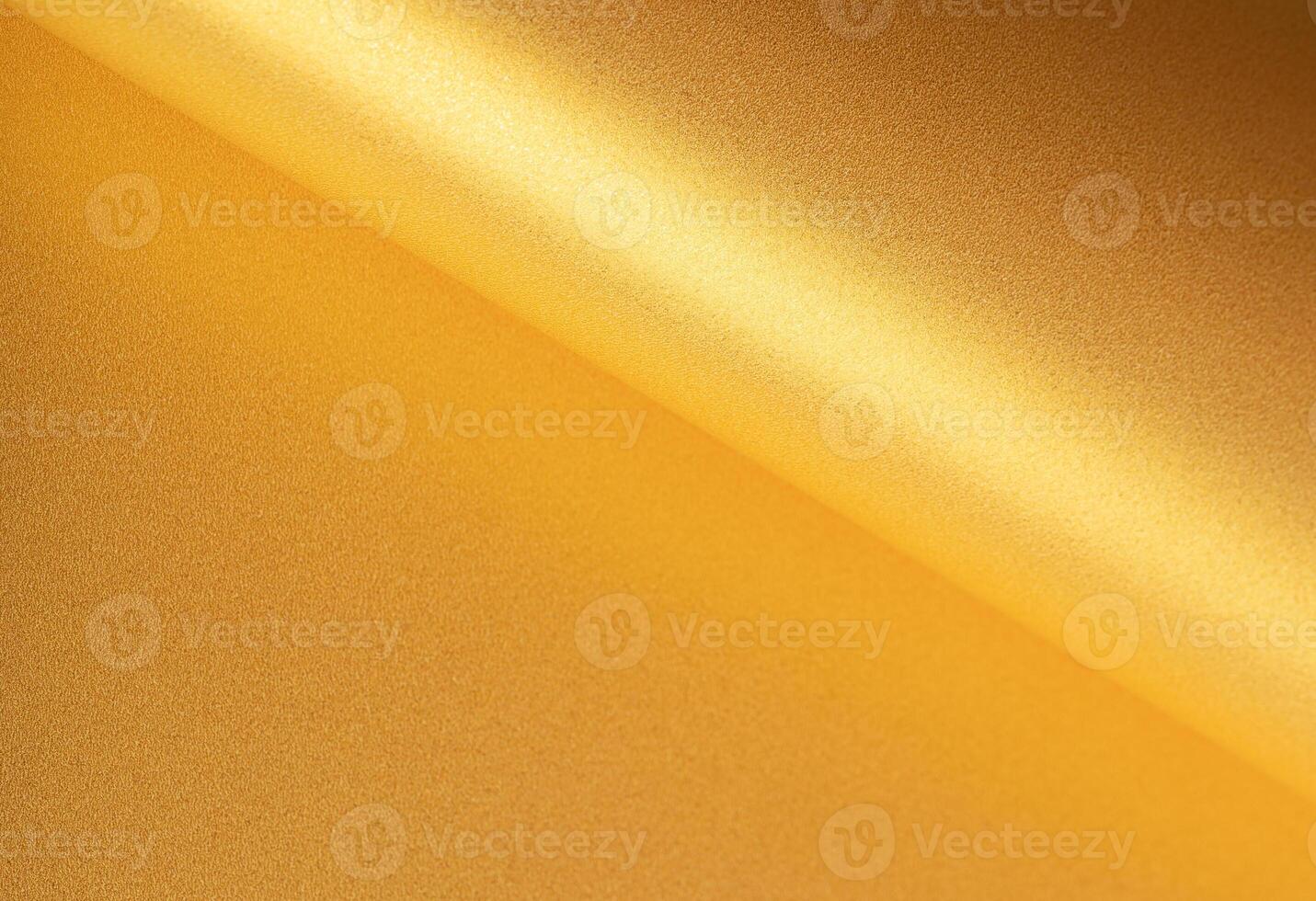Gold paper background with a shiny, glossy surface and smooth gradient. Elegant and luxurious photo