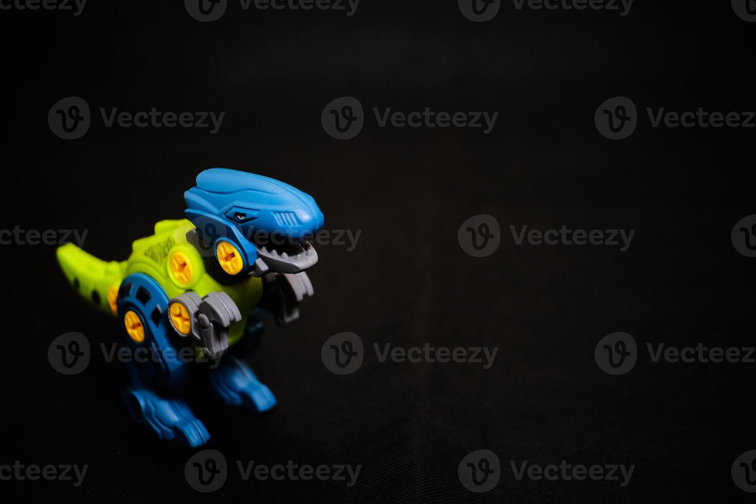 Robot T-Rex Toy on Dark Background - Mechanical Dinosaur photo