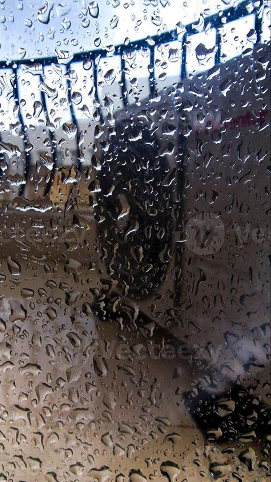 Rainy Window View at Airport Blurred Background with Water Droplets photo