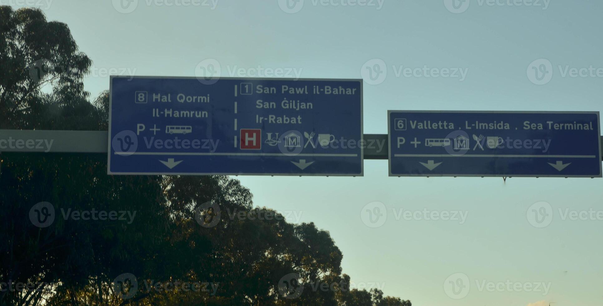 Malta Road Signage at Sunset Directions to Major Cities photo