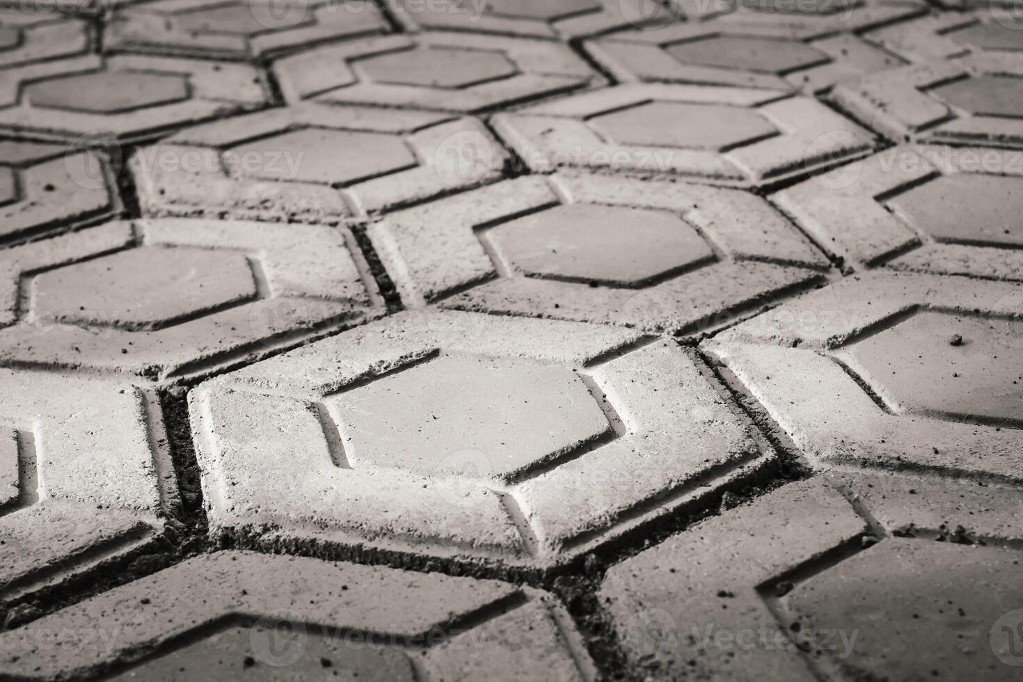Black and white hexagonal brick for flooring. Paving block backgrounds in monochrome color. Texture and Details. Bricks and blocks are made from cement. Negative Space photo