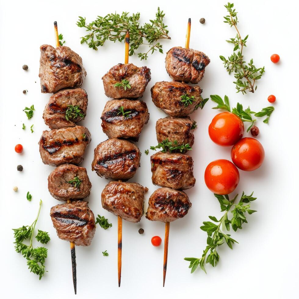 Grilled meat skewers with tomatoes and herbs on a white background photo