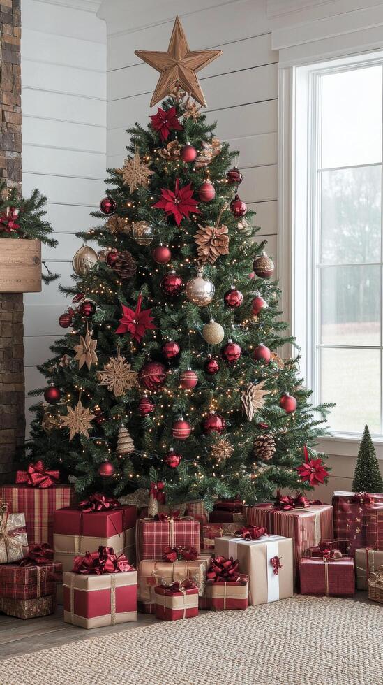 A christmas tree with presents and decorations in front of a fireplace photo