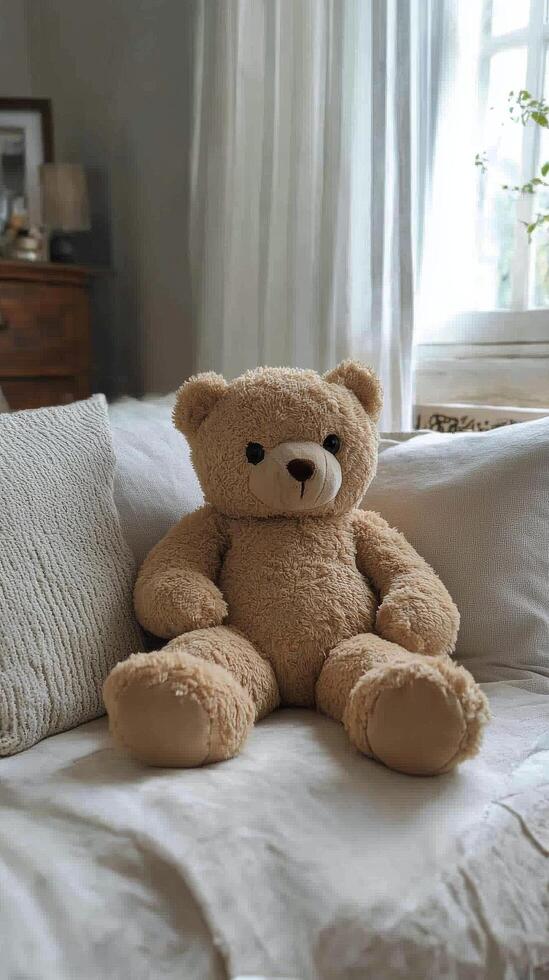 A teddy bear sitting on a bed photo
