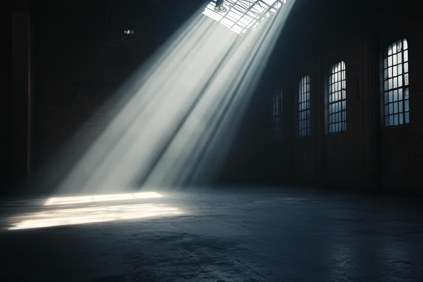 A dark room with sunlight shining through the windows photo