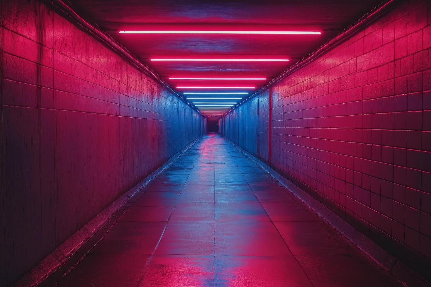 A long tunnel with neon lights and a red light photo