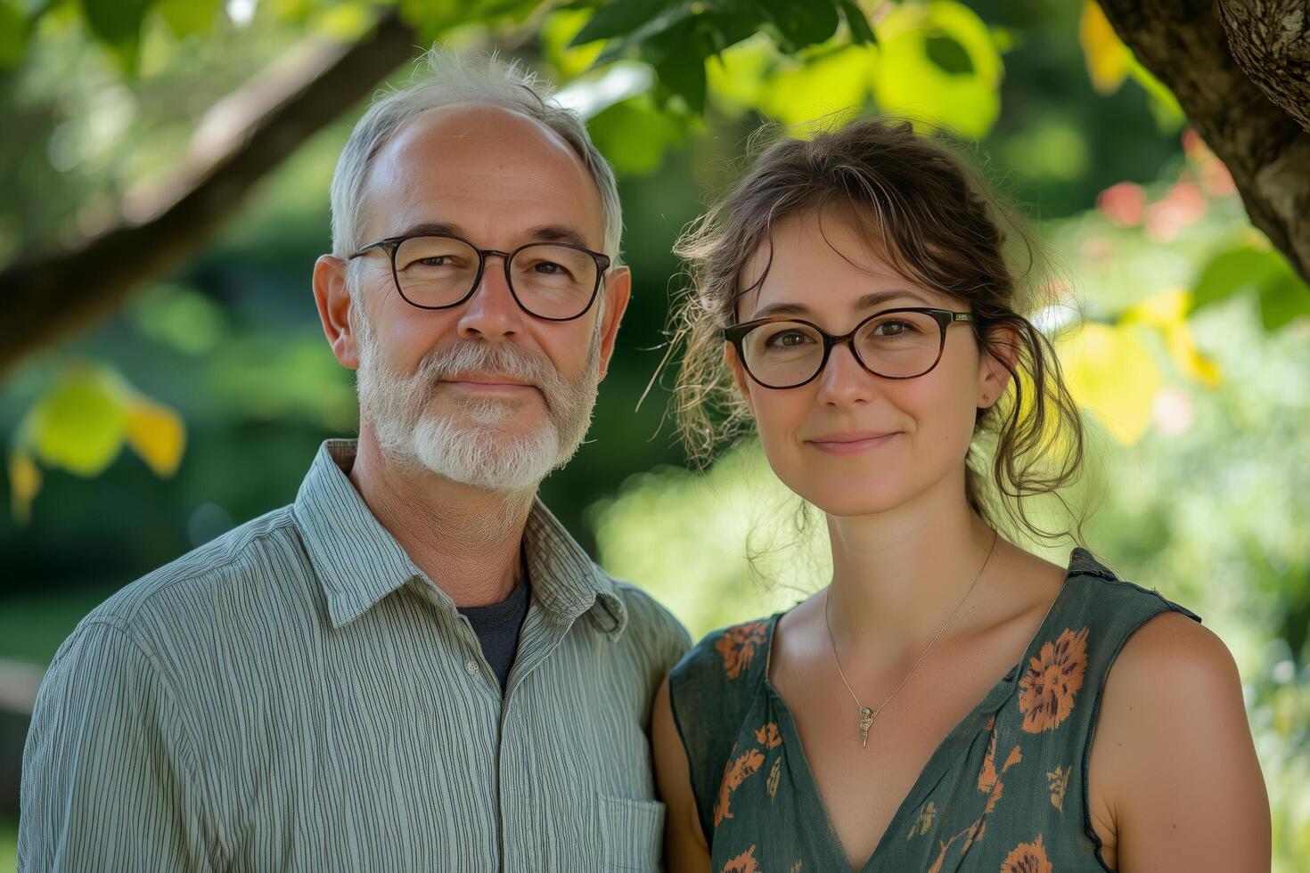 A man and woman standing in front of a tree photo