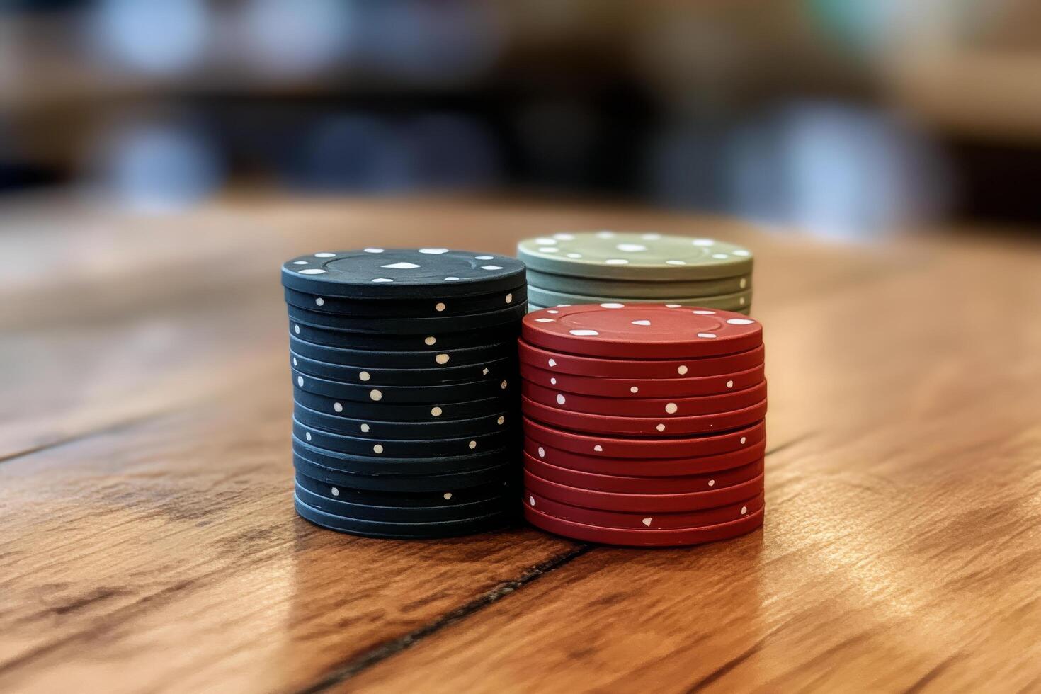 A stack of poker chips on a wooden table photo