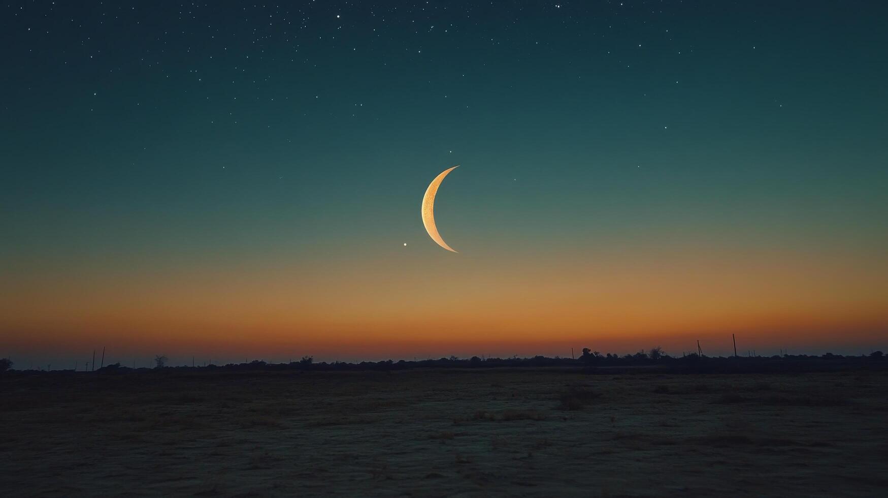 The moon and crescent are seen in the sky at sunset photo