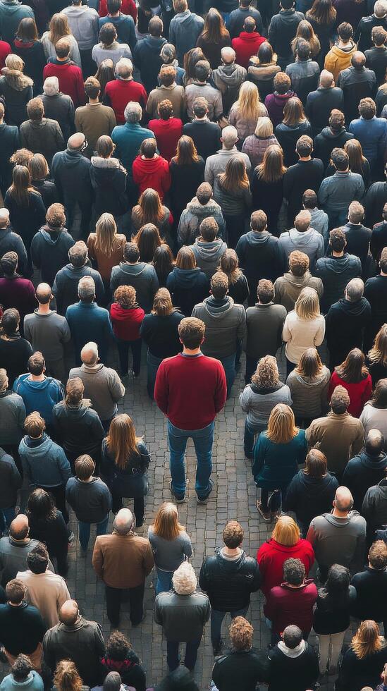 A man standing in the middle of a crowd photo