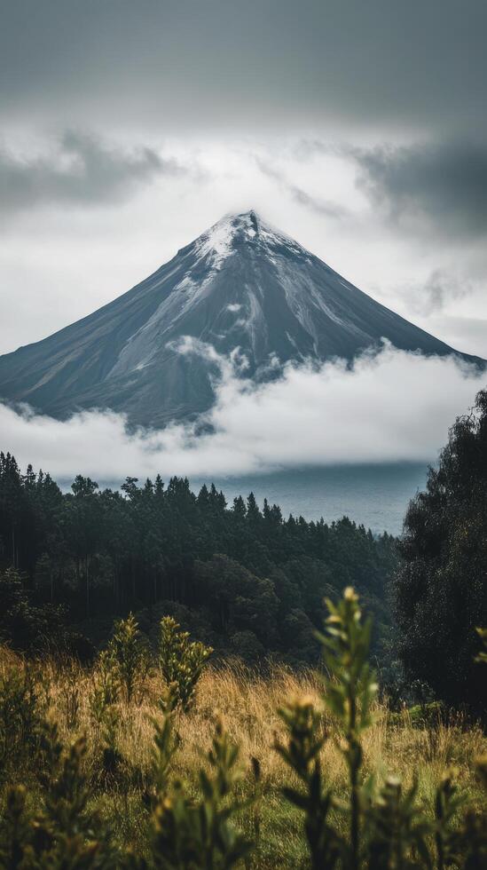 A mountain is seen in the distance with clouds photo