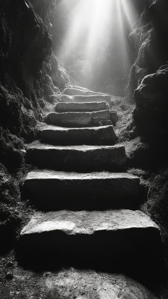 A black and white photo of stairs leading into a cave