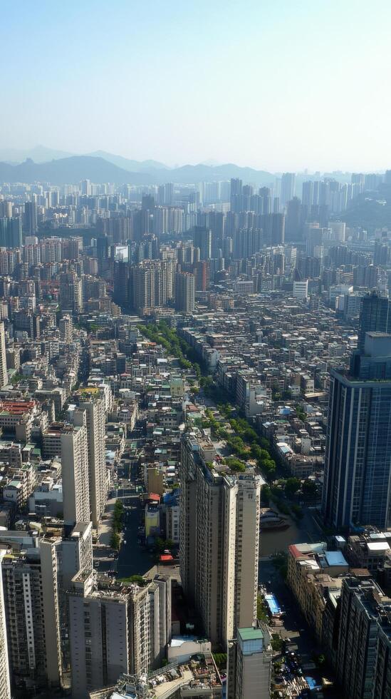 A cityscape with tall buildings and a river photo