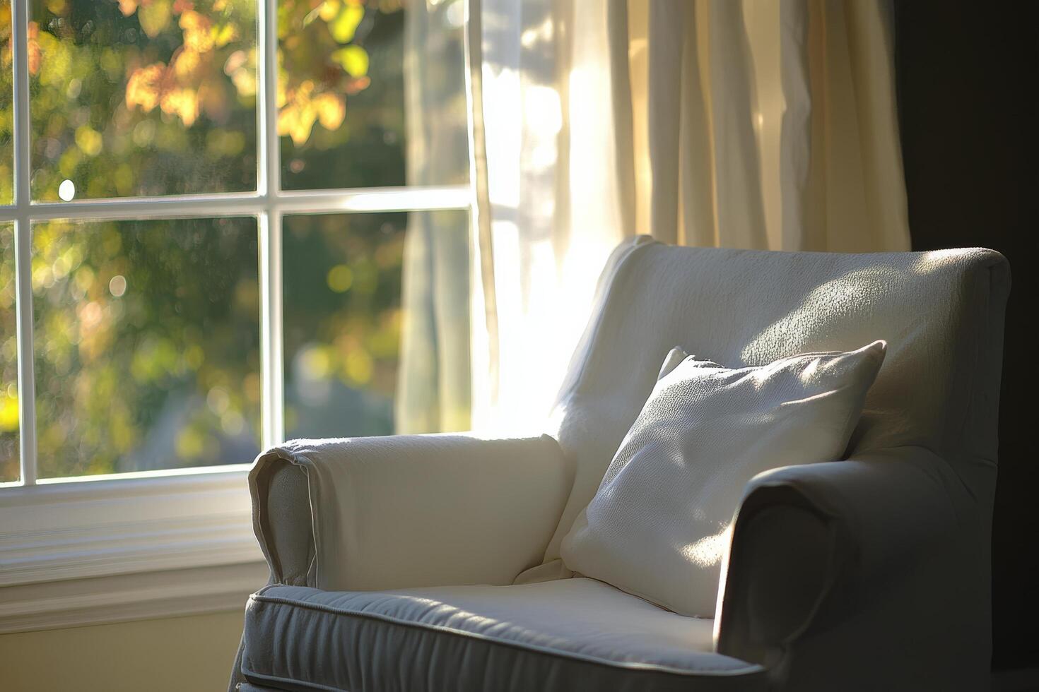 A white chair with a pillow on it photo