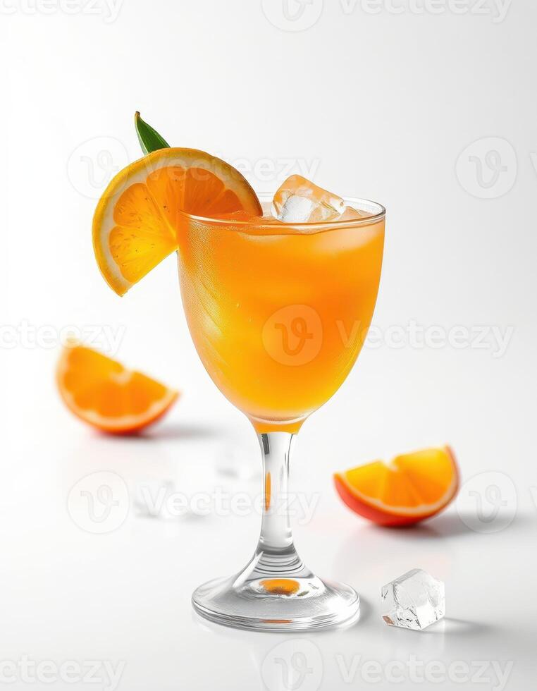 Fresh orange cocktail served in a glass with ice on a minimalistic white background photo