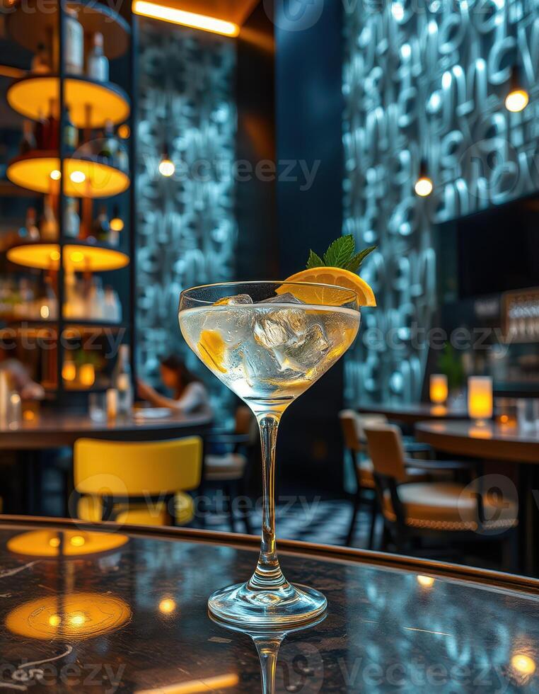 Refreshing cocktail with lemon and mint served in a stylish lounge setting during the evening photo