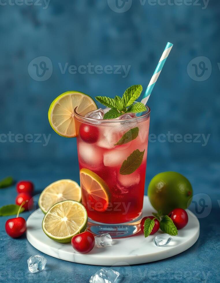 Refreshing summer cocktail with cherries, lime, and mint garnished with colorful straw photo