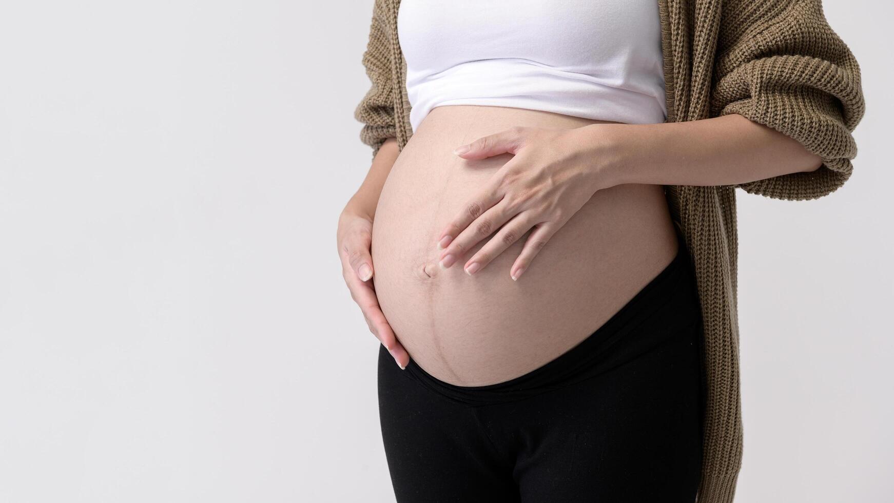 pregnant woman on white background photo