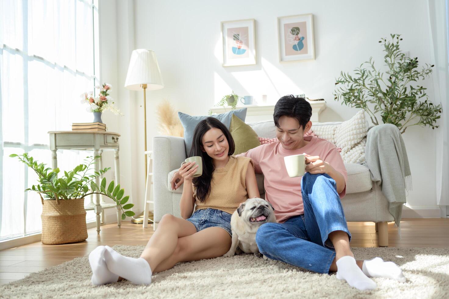 Couple Enjoys Cozy Morning Together With Their Pet Dog in a Bright Living Room Setting photo