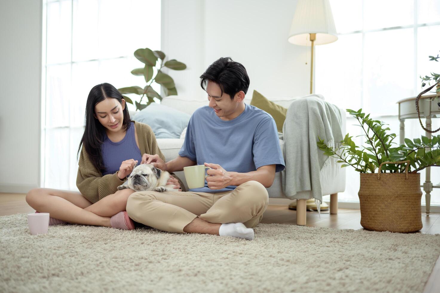 Couple Enjoys Morning Together With Their Pet Dog in a Bright Living Room Setting photo