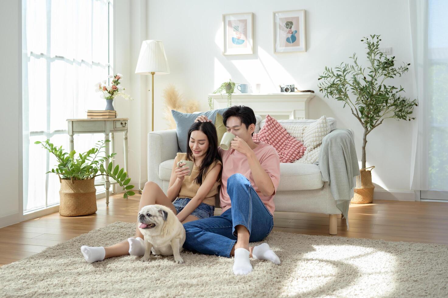 Couple Enjoys Together With Their Pet Dog in a Bright Living Room Setting photo