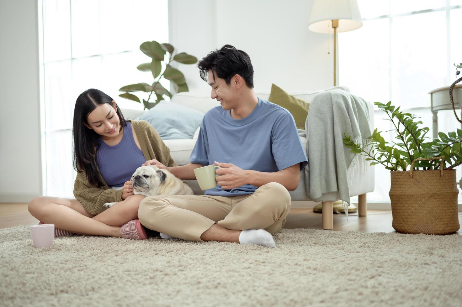 Couple Enjoys Morning Together With Their Pet Dog in a Bright Living Room photo