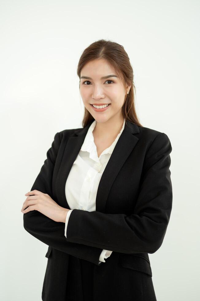 Young Woman in Black Suit Stands Confidently Against a Plain Background photo