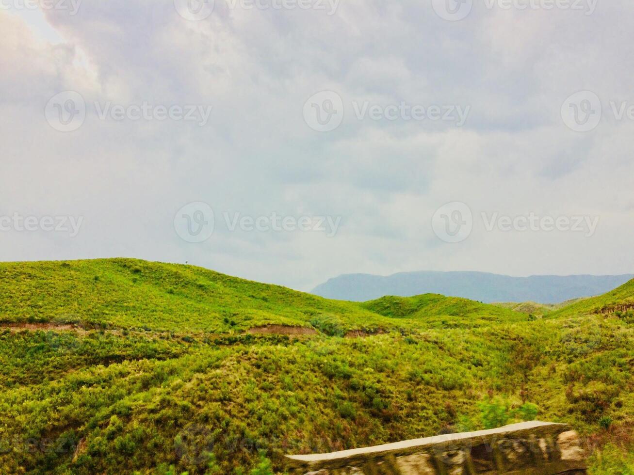 A bench sitting on a hillside photo