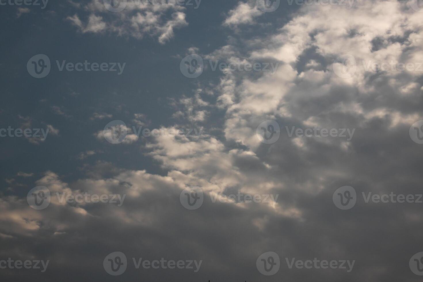 A plane flying in the sky with a cloud in the background photo