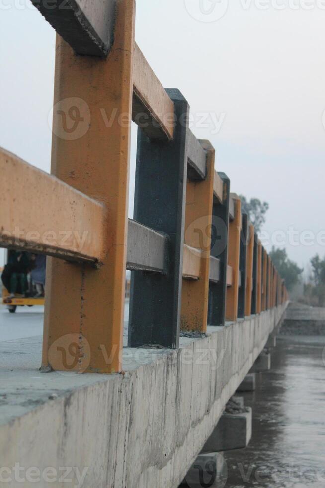 A bridge with a lot of beams and a lot of water photo
