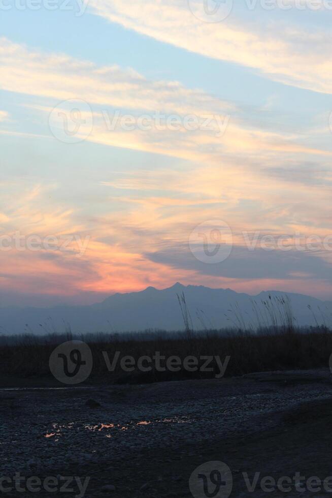 A person flying a kite in the sky photo