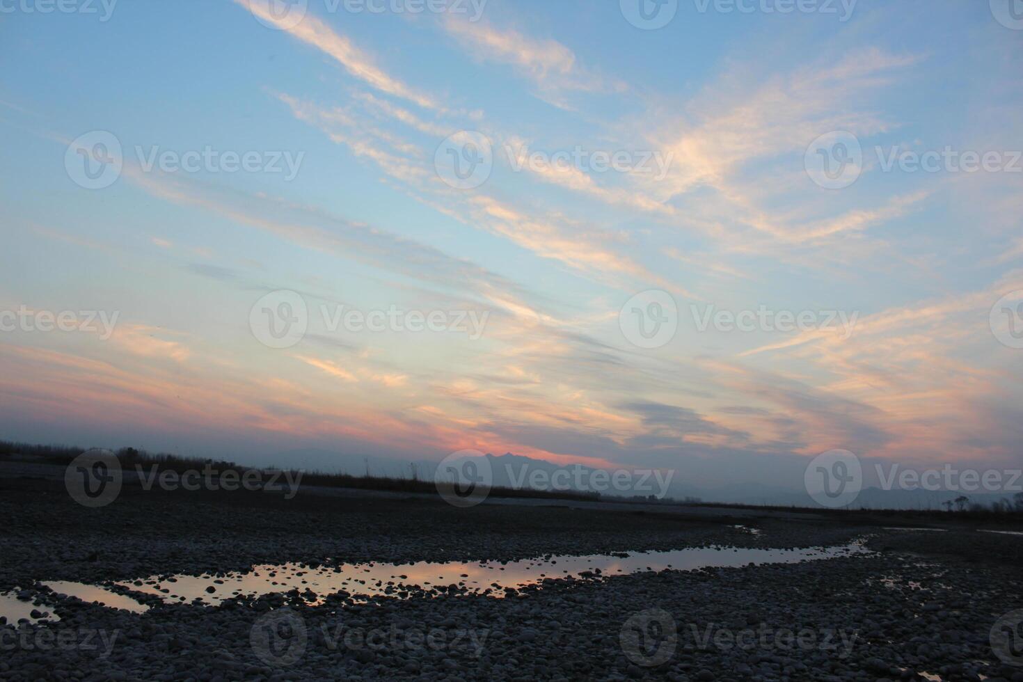 A person flying a kite in the sky photo