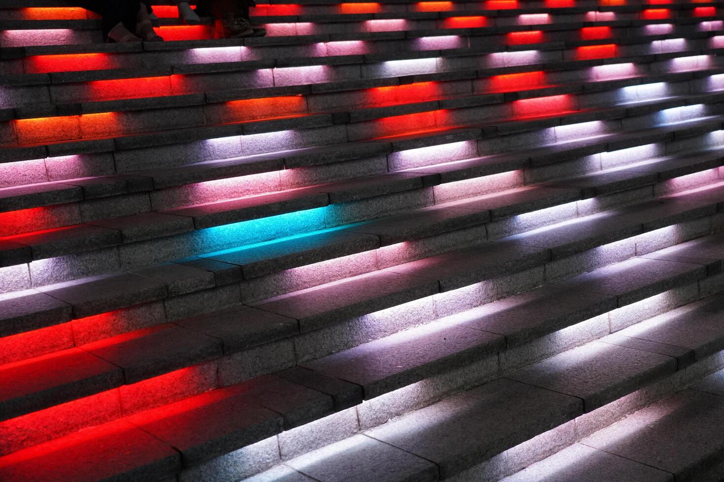 a row of colorful lights on stairs photo