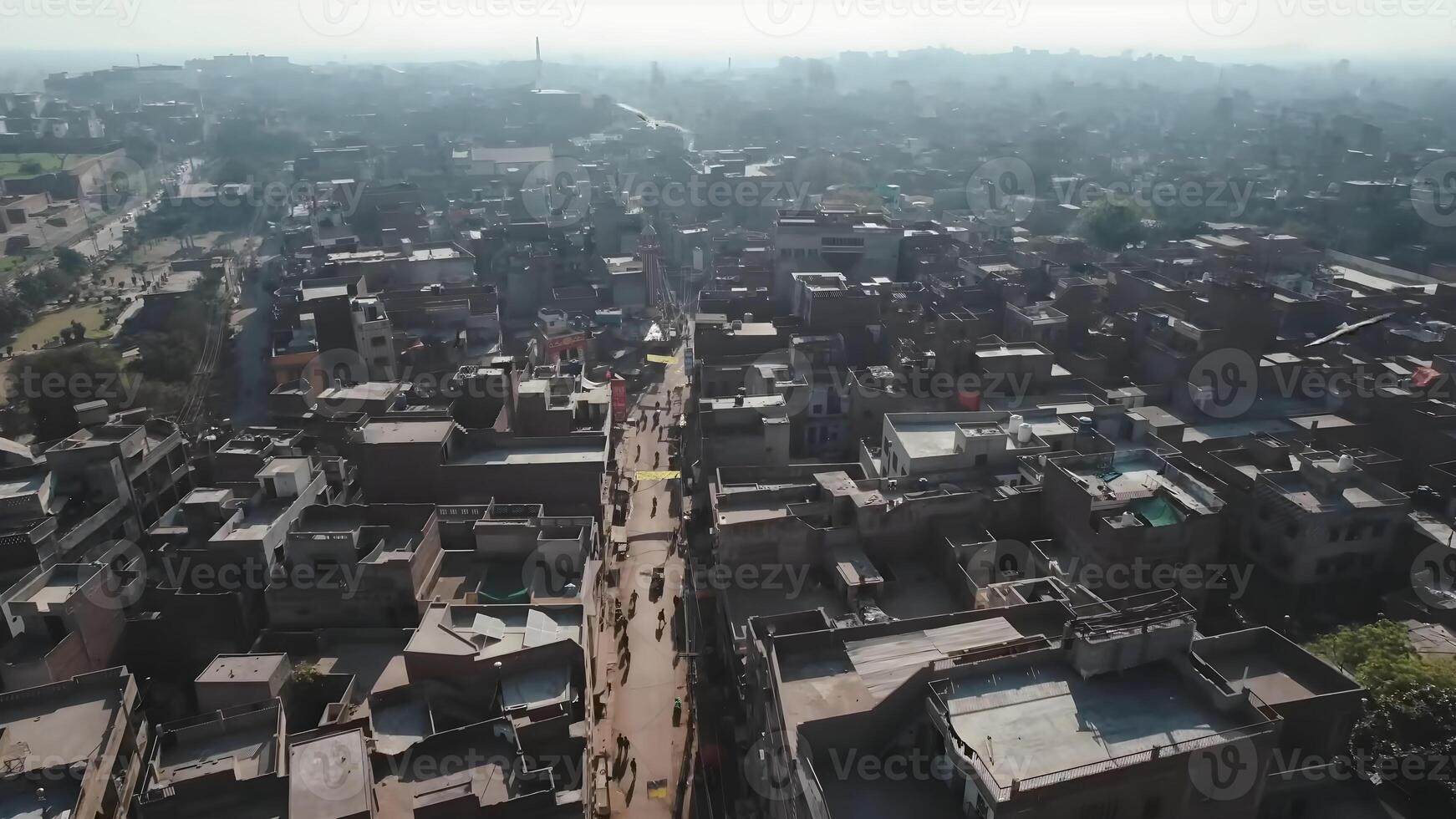 Aerial Perspective of Bustling City Streetscape with Traditional Architecture and Hazy Skyline photo
