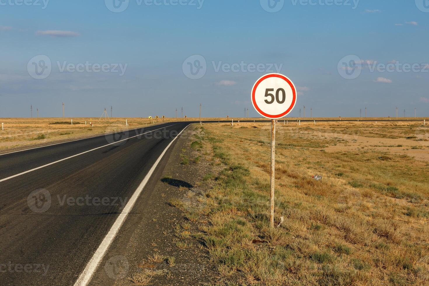 Speed limit sign along a desolate road in Atyrau Region Kazakhstan photo