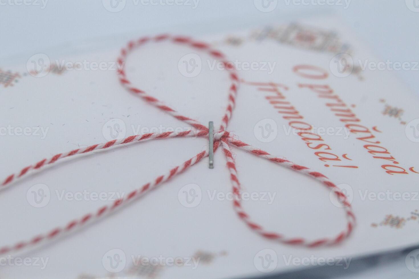 Card with Red and White Twine Bow and Romanian Text photo