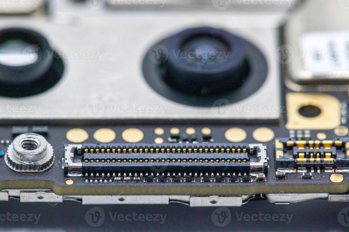 Smartphone Internal Circuit Board Detail Connector and Camera Lenses photo