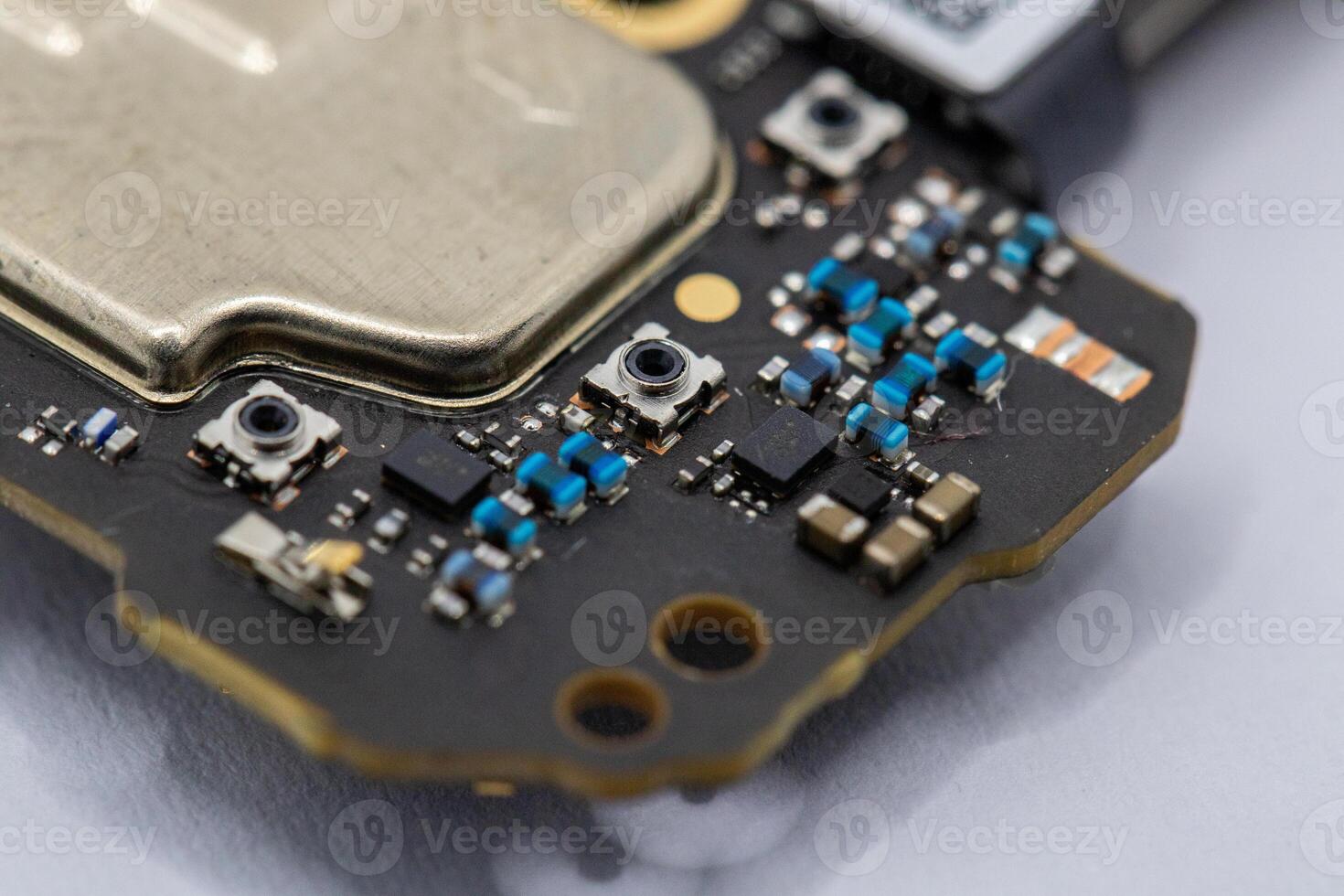 Close-up of Electronic Circuit Board Fragment with Components photo