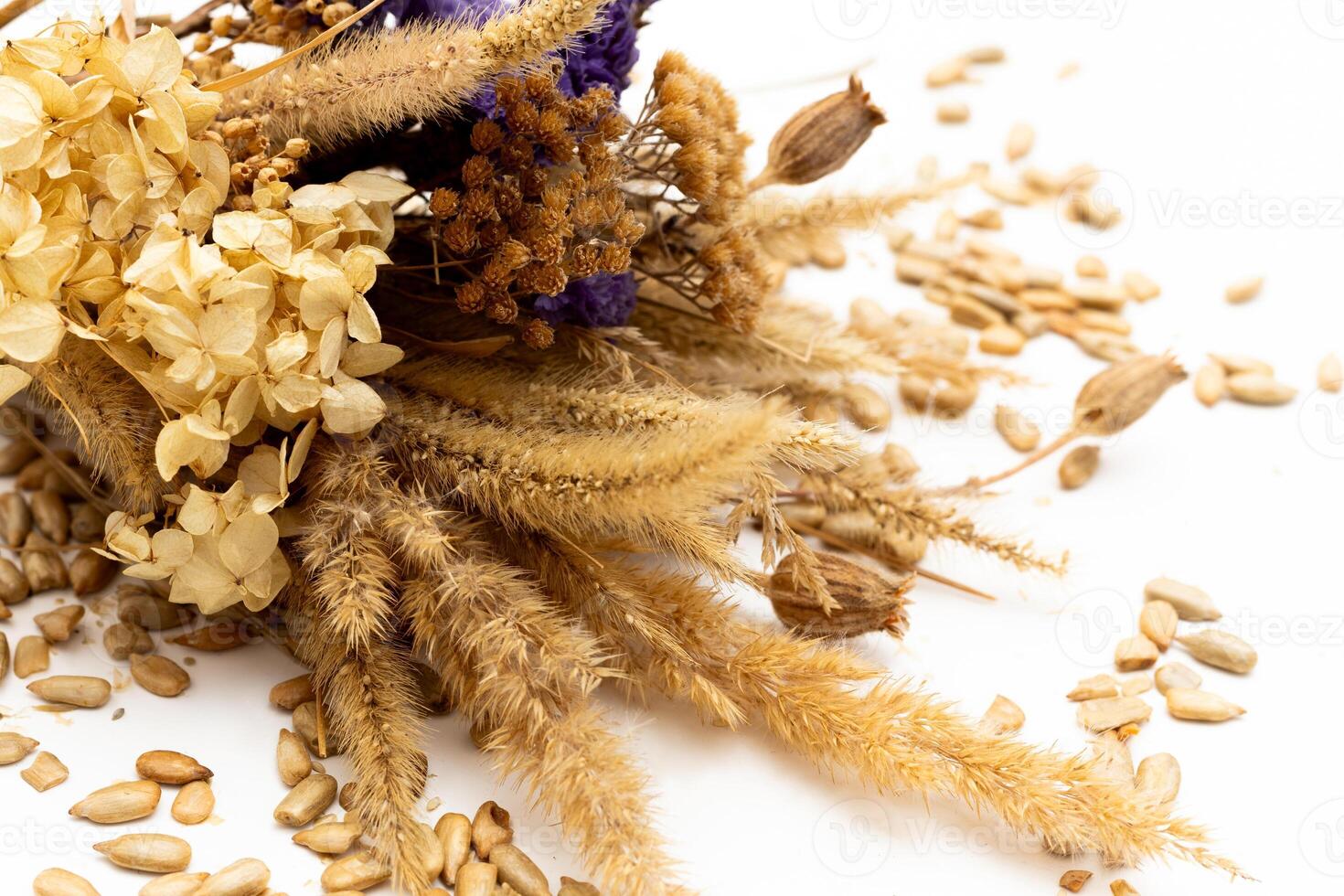 A bouquet of dried flowers with a yellow and blue ribbon of the flag of Ukraine on the background photo